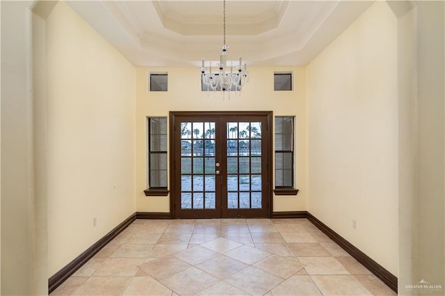 interior space featuring crown molding, french doors, light tile patterned flooring, and a chandelier