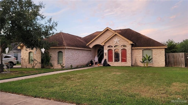 french country home with a yard