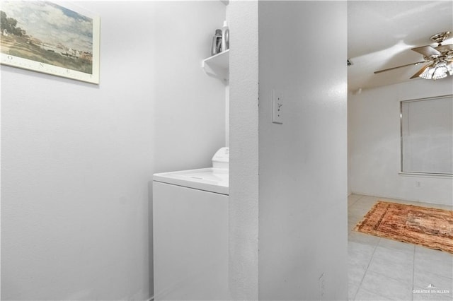 laundry room featuring washer / clothes dryer, ceiling fan, and light tile patterned floors