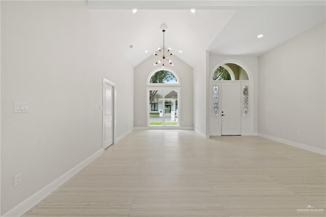 600 Bluebird Ave, Mcallen, TX 78504 - foyer entrance featuring a chandelier, recessed lighting, baseboards, and high vaulted ceiling