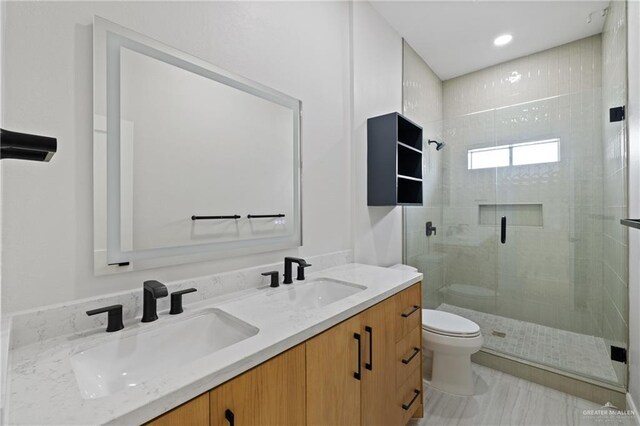 600 Bluebird Ave, Mcallen, TX 78504 - bathroom with toilet, a stall shower, and double vanity