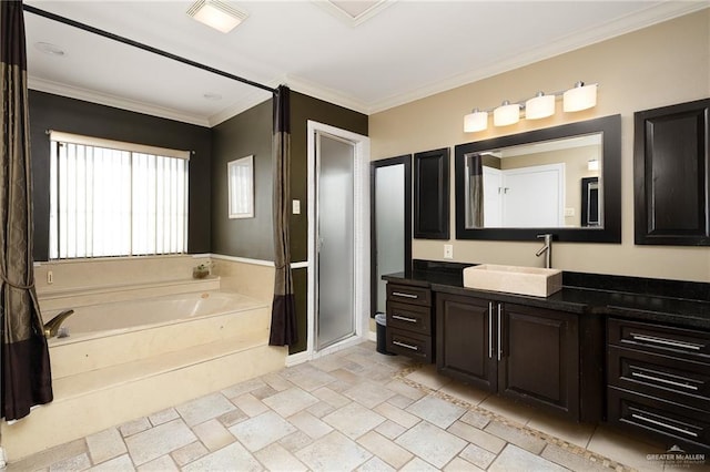 bathroom with ornamental molding, vanity, and shower with separate bathtub