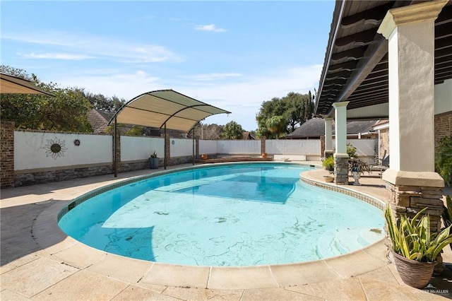 view of pool featuring a patio area