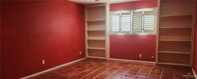 unfurnished room featuring tile patterned flooring