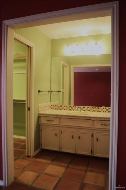 bathroom with tile patterned flooring and vanity