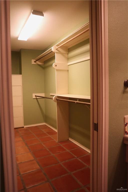 walk in closet featuring tile patterned flooring