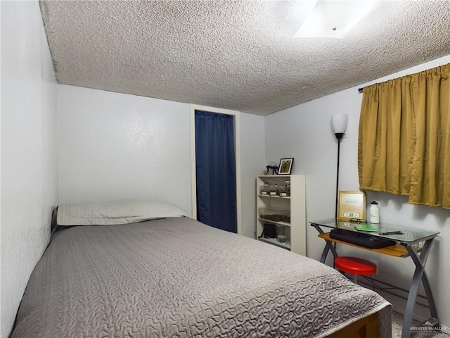 bedroom featuring a textured ceiling