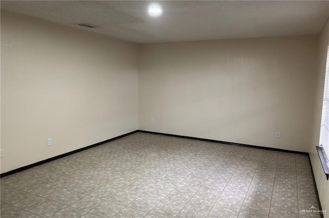 2113 Dallas Ave, Mcallen, TX 78501 - empty room featuring baseboards and visible vents