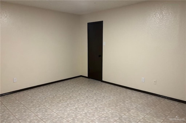 2113 Dallas Ave, Mcallen, TX 78501 - empty room featuring baseboards