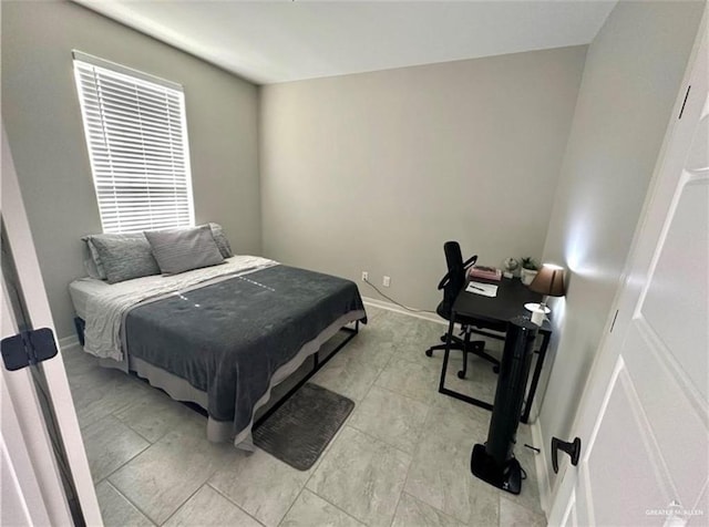 bedroom with baseboards