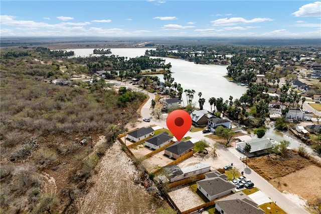 drone / aerial view with a residential view and a water view