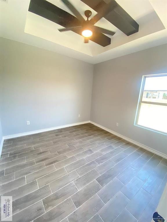 1271 Stirrup Cir, San Benito, TX 78586 - unfurnished room featuring a raised ceiling, ceiling fan, and baseboards