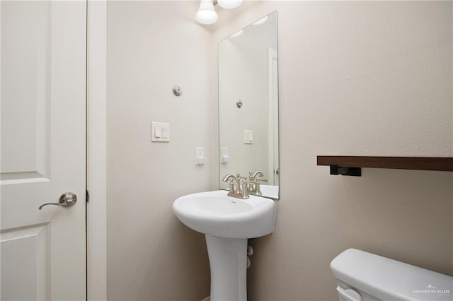 bathroom featuring toilet