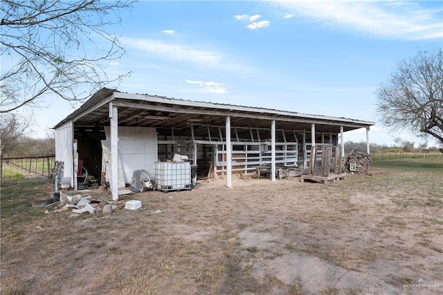 view of outbuilding featuring a rural view