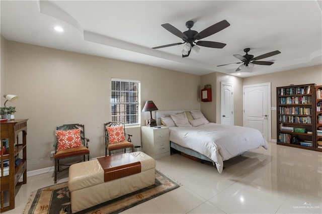 tiled bedroom featuring ceiling fan