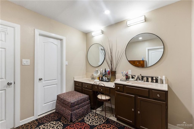 bathroom with vanity and tile patterned flooring