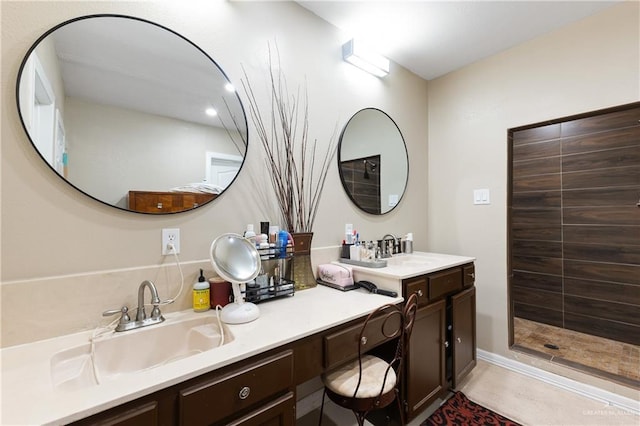 bathroom featuring vanity and a shower