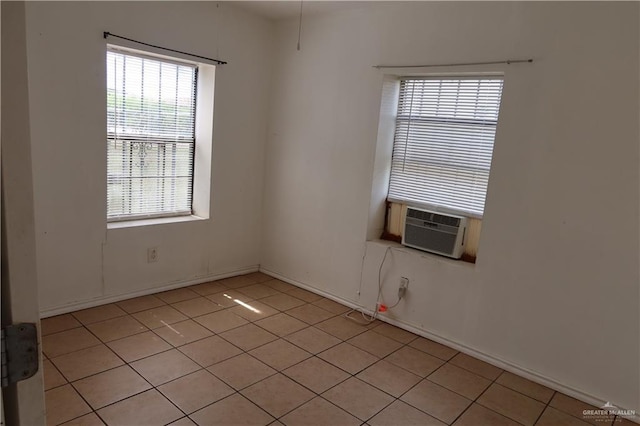 116 N Kansas Ave, Weslaco, TX 78596 - empty room with light tile patterned floors and baseboards