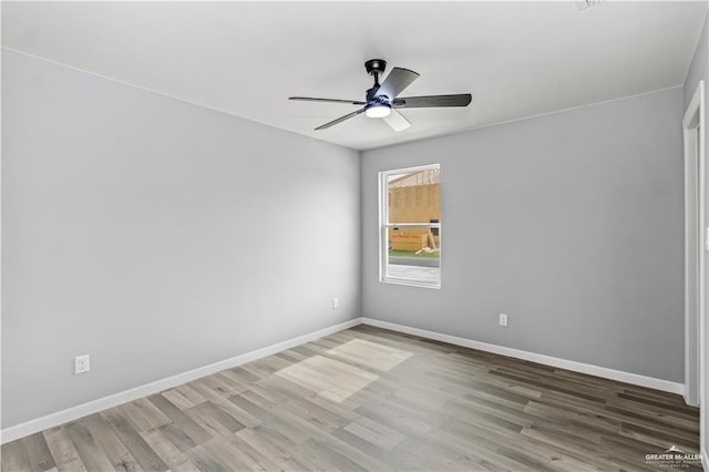 empty room featuring ceiling fan and hardwood / wood-style flooring