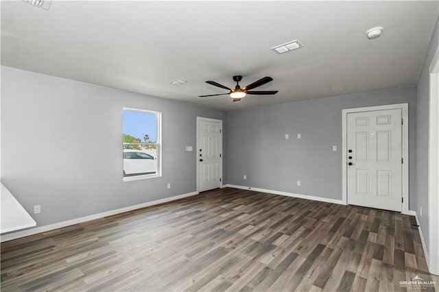 interior space featuring ceiling fan and dark wood-type flooring