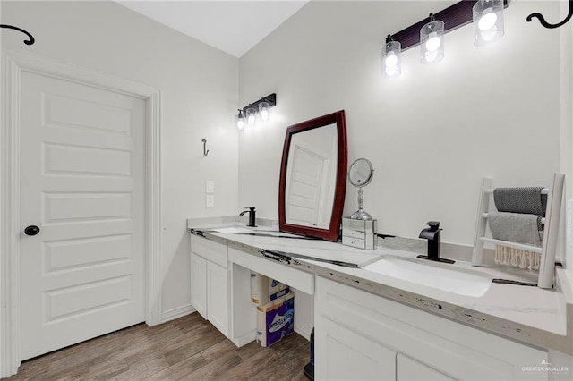 308 N Holland Ave, Mission, TX 78572 - full bath featuring wood finished floors and double vanity