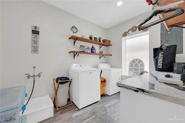 308 N Holland Ave, Mission, TX 78572 - laundry room with washing machine and dryer, light wood finished floors, and recessed lighting