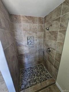 bathroom with tiled shower