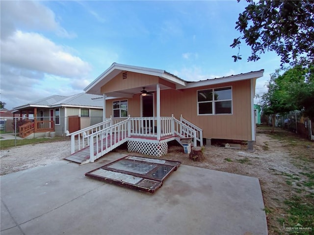 view of front of property featuring covered porch, a patio, and ceiling fan