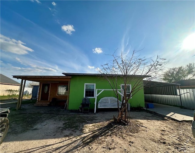 exterior space featuring stucco siding