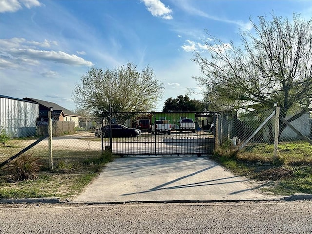 view of gate featuring fence