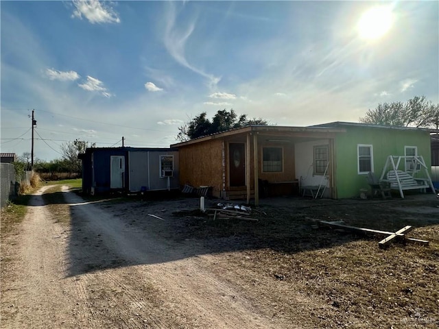 back of house with driveway