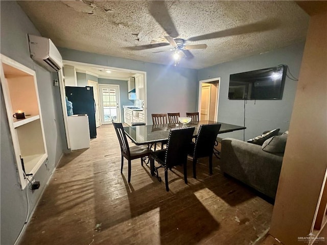 dining room with wood-type flooring, a ceiling fan, a textured ceiling, and a wall mounted AC