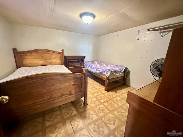 bedroom featuring light floors