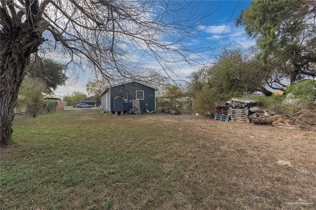 view of yard with an outbuilding and a storage shed