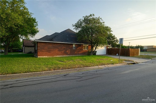 1905 N 8th St, Harlingen, TX 78550 - view of front of property with concrete driveway, an attached garage, and brick siding