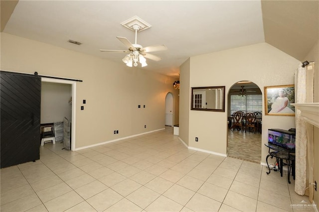 1905 N 8th St, Harlingen, TX 78550 - empty room featuring arched walkways, ceiling fan, light tile patterned floors, baseboards, and a barn door