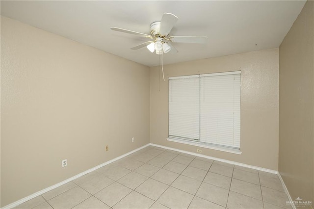1905 N 8th St, Harlingen, TX 78550 - empty room with ceiling fan, light tile patterned flooring, and baseboards