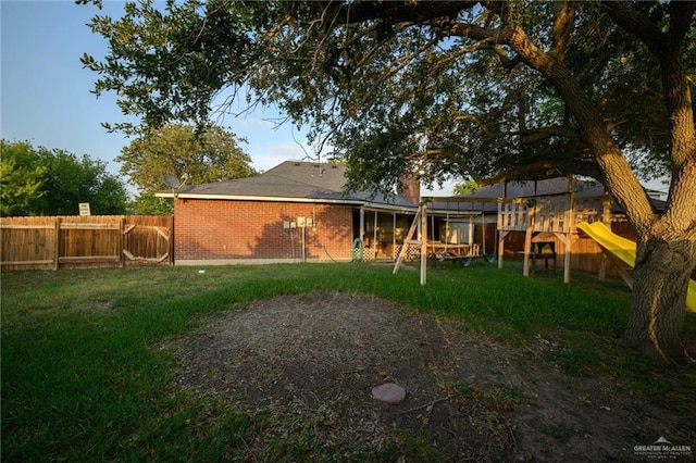 1905 N 8th St, Harlingen, TX 78550 - back of property featuring a playground and brick siding