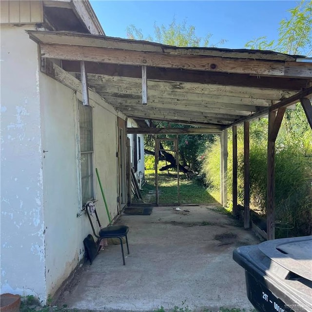 view of parking / parking lot with a carport