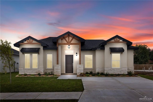 view of front of property with a yard