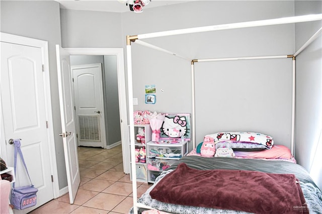 bedroom with light tile patterned floors