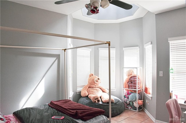 tiled bedroom with ceiling fan