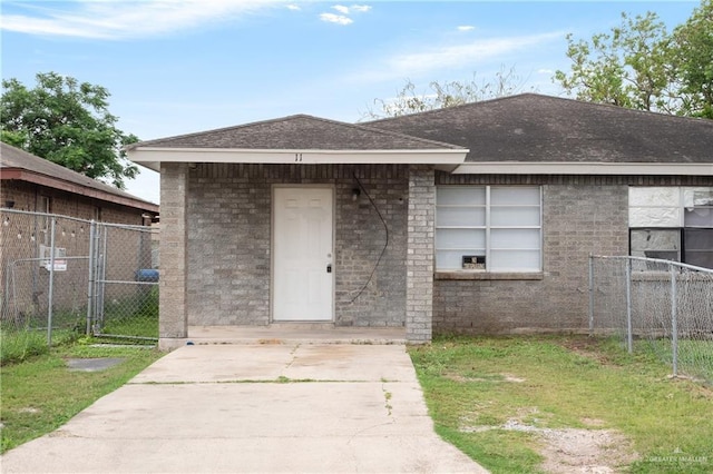 6614 Simon Place Ave, Brownsville, TX 78526 - view of front of home featuring fence, a gate, and roof with shingles