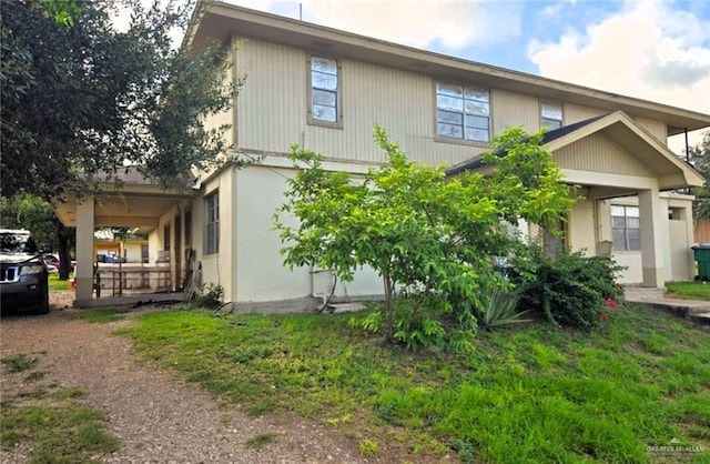 view of side of home with a porch