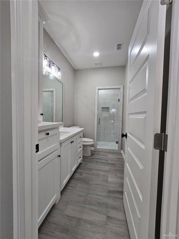 1204 Cornerstone Loop, Rio Grande City, TX 78582 - bathroom featuring a stall shower, vanity, toilet, and visible vents
