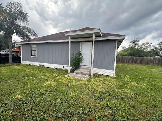 back of house with a yard