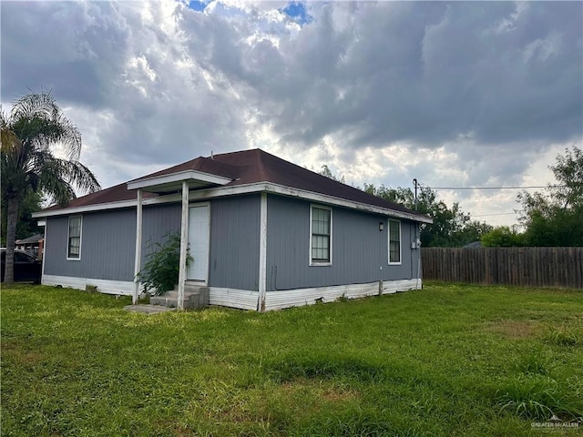 view of property exterior featuring a yard