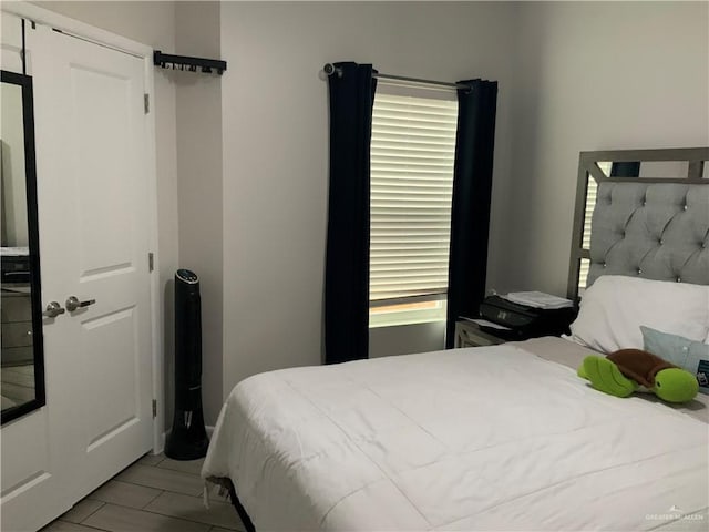 bedroom featuring multiple windows