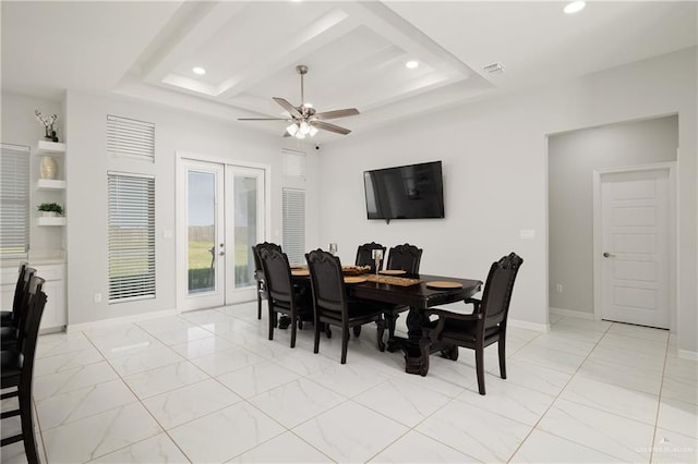 dining room with ceiling fan, built in shelves, and french doors