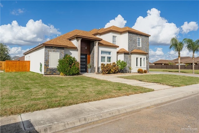 view of front of home featuring a front lawn